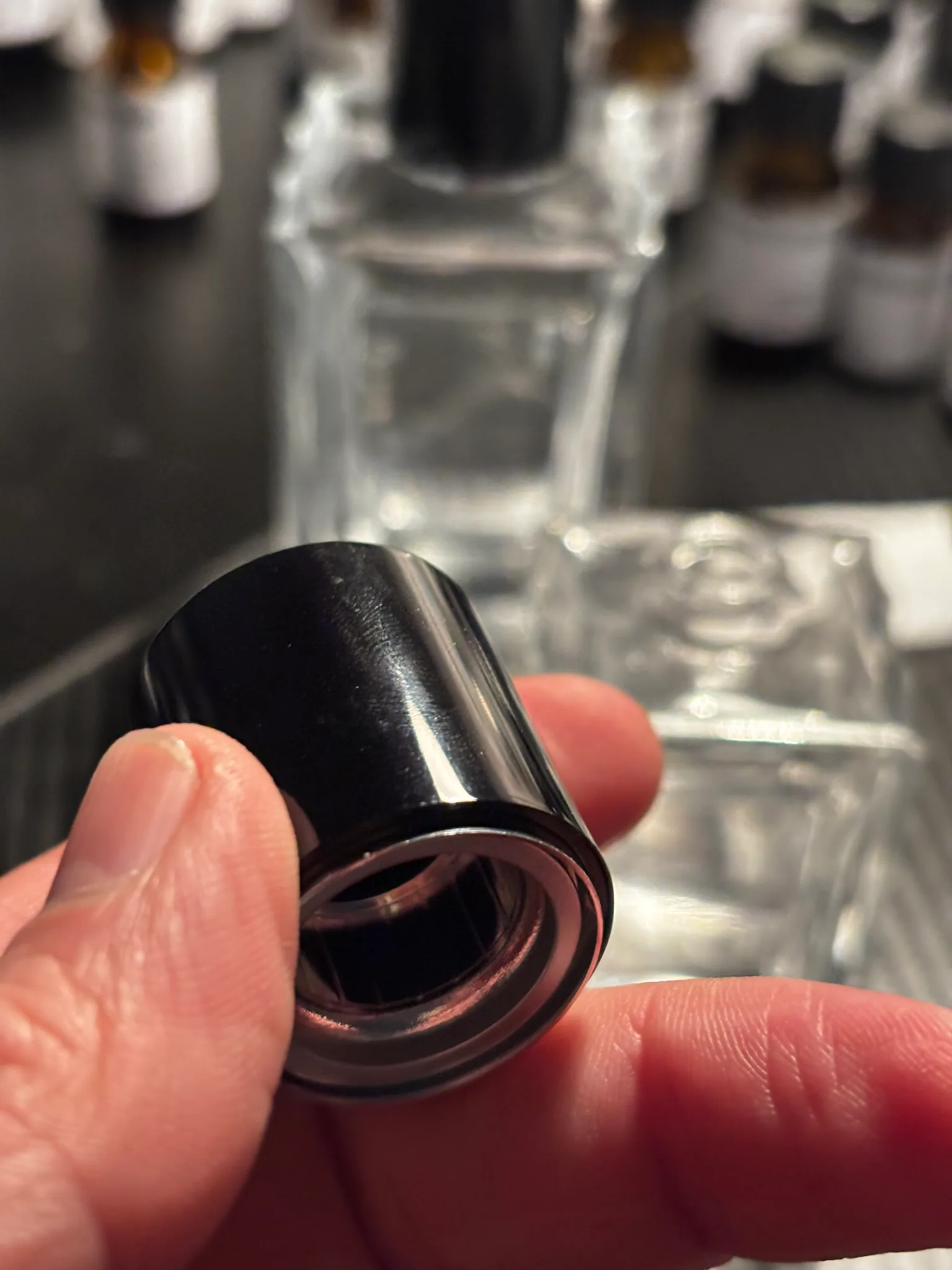 Inspecting the finish of an Avilés fragrance bottle